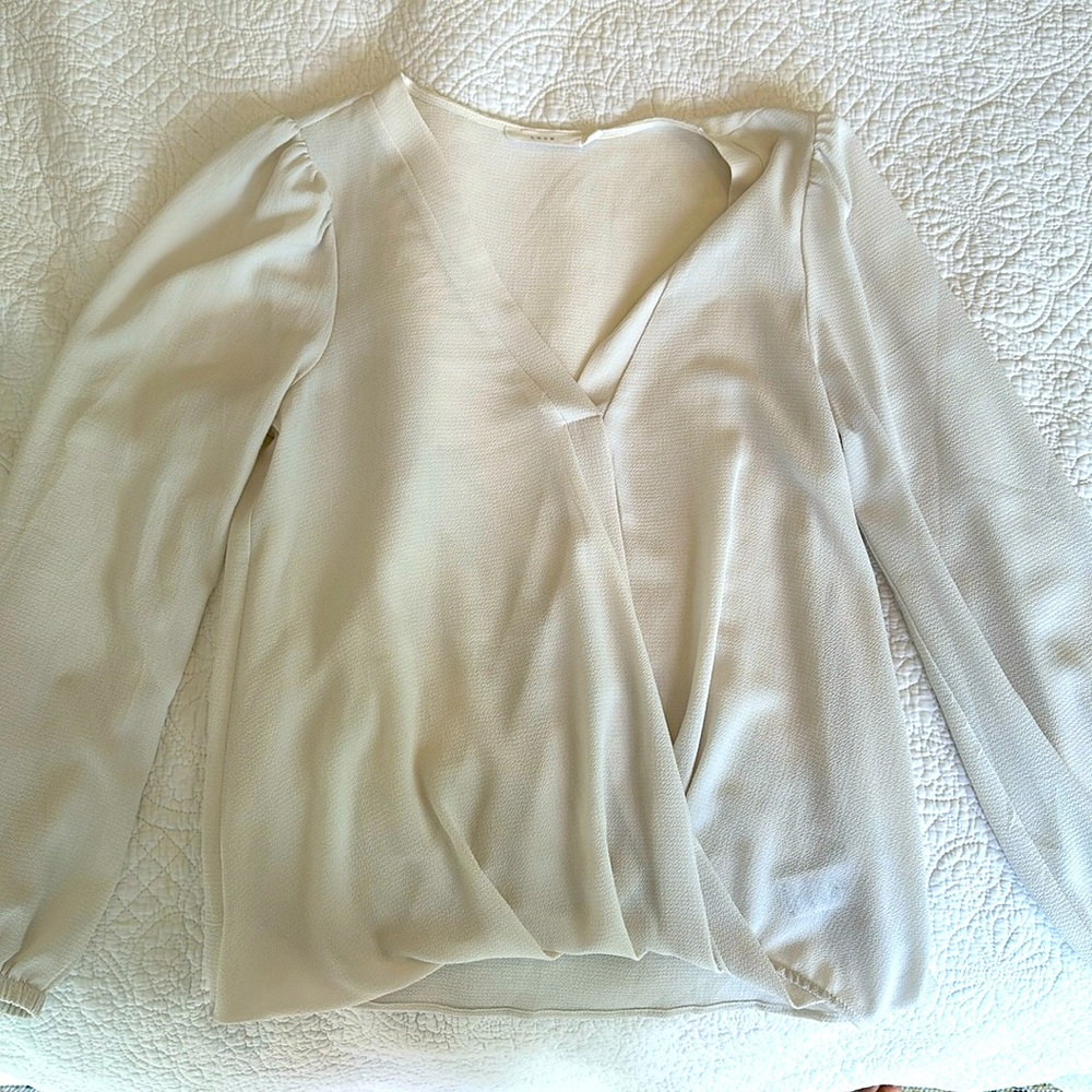 Cream colored Lush crossover blouse. Size S. Wrinkle free, runched wrists.